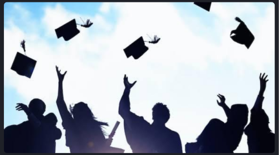 Graduating students throwing up their caps